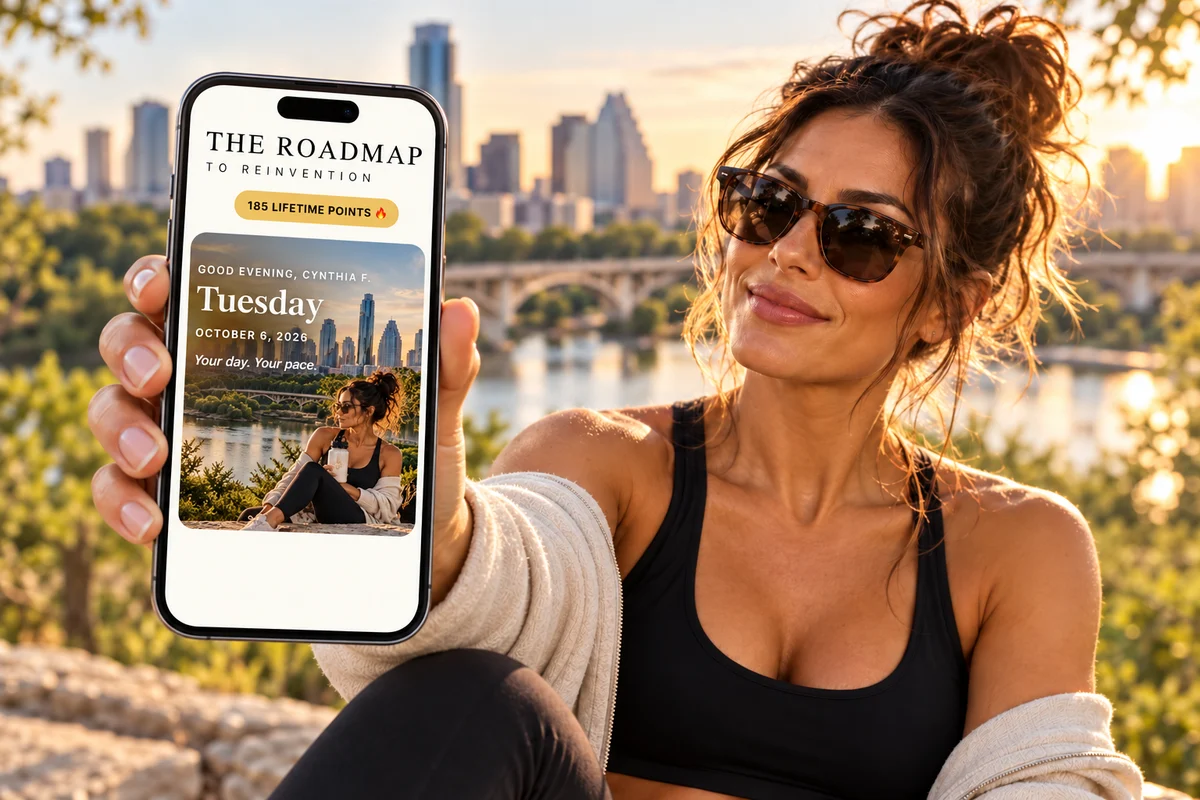A woman showing The Roadmap companion app on a phone beside the Austin skyline